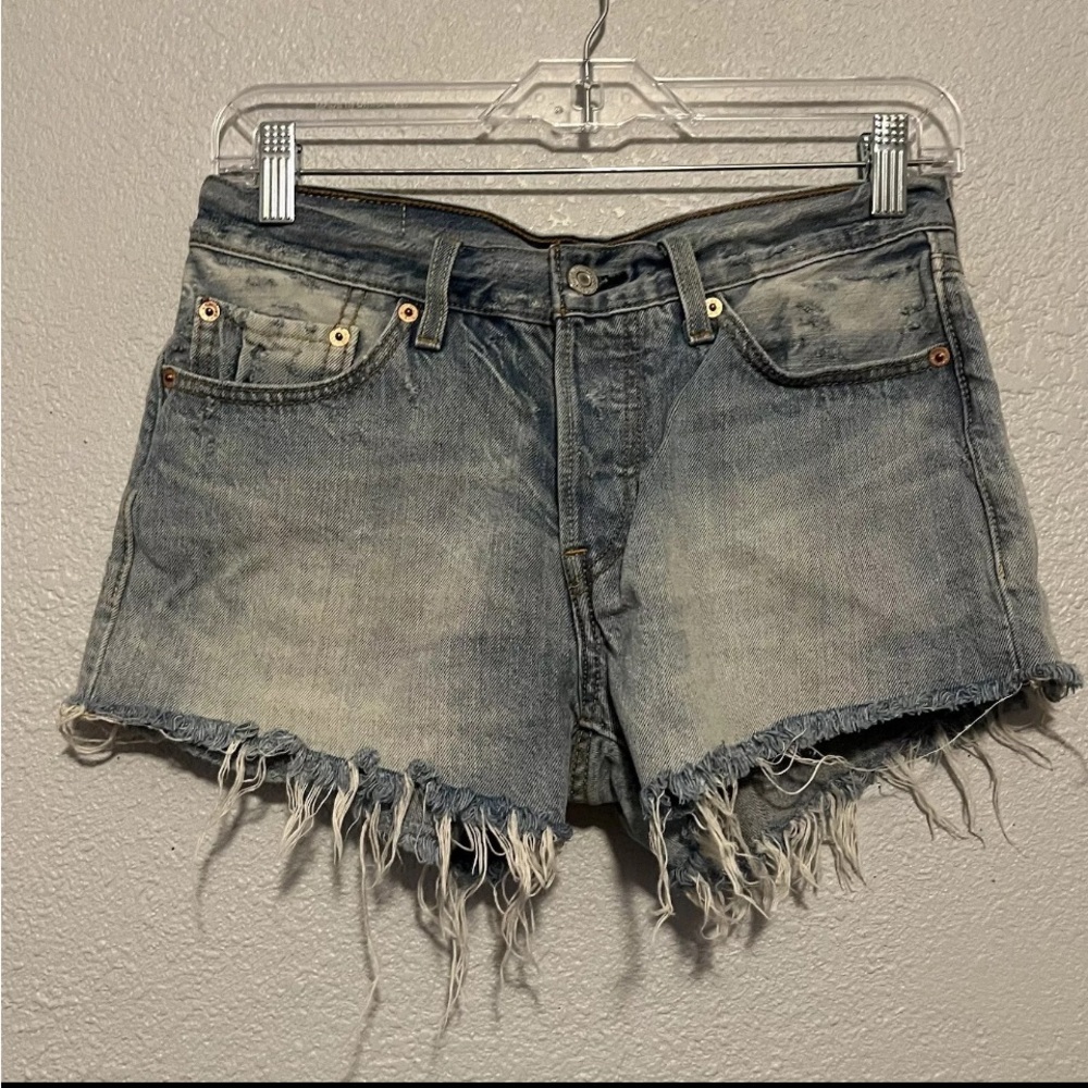 Distressed Levi's 501 button up denim light color washed cutoff shorts size 26 ￼
